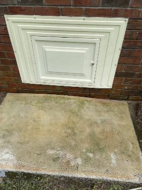 After: crawlspace access door and concrete step pressure washed clean