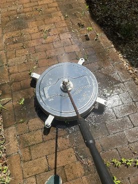 A surface cleaner running on pavers